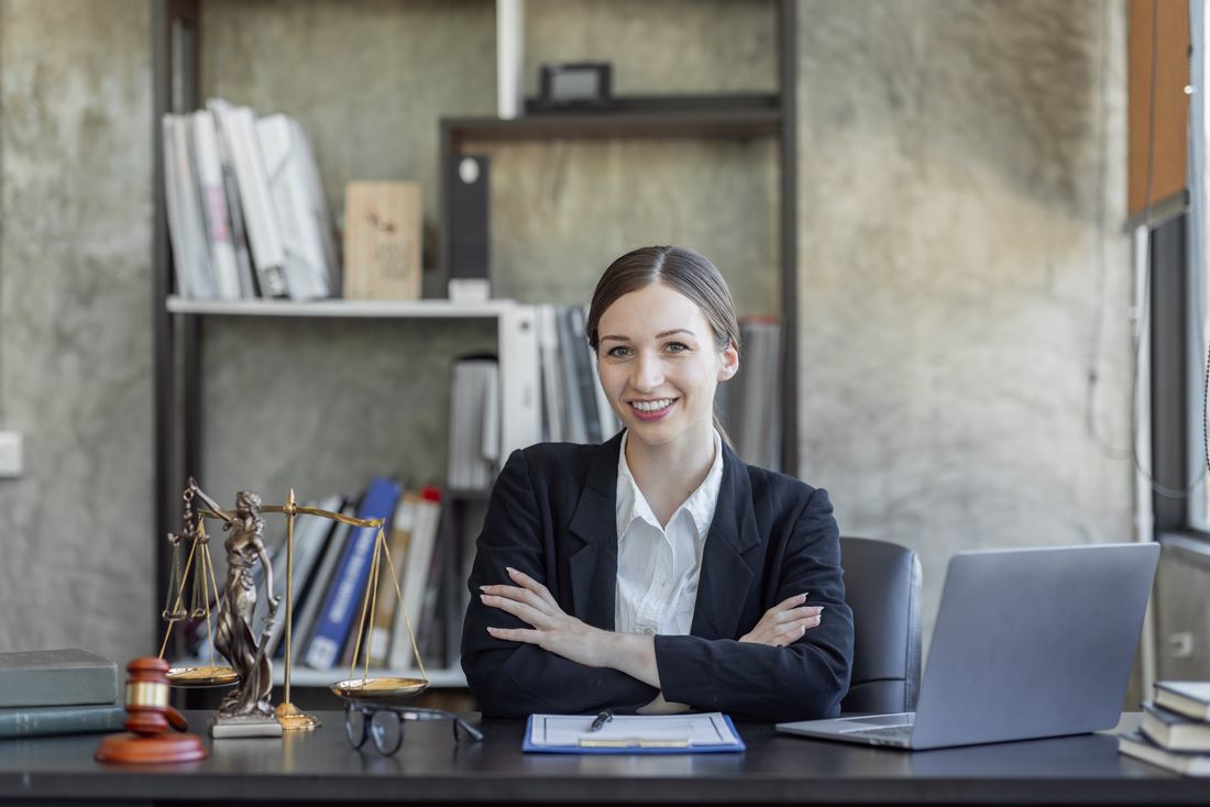 A statue of justice on a lawyer's desk